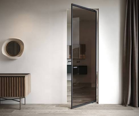 Open pivot door with dark glass