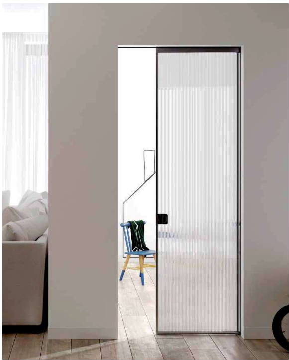 Reeded glass sliding door between bright living spaces